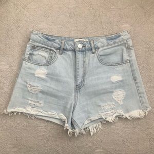 Light blue distressed denim shorts